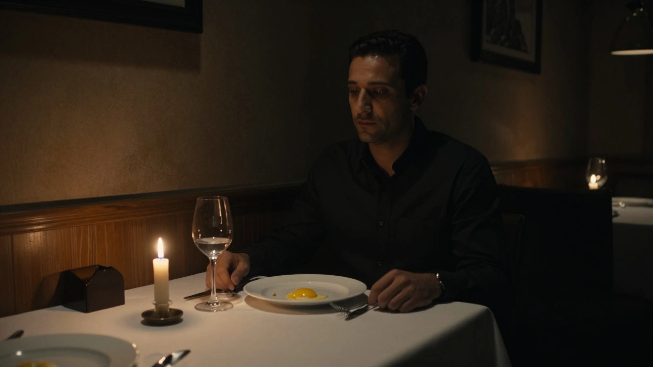 A man sitting alone in a dim restaurant, staring at an empty plate, candlelight casting quiet shadows.