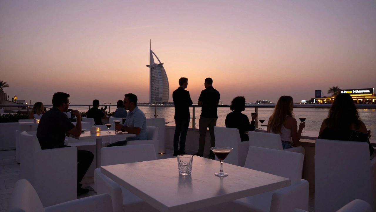 Sunrise over White Dubai’s terrace as guests quietly unwind after midnight, white décor bathed in dawn light.